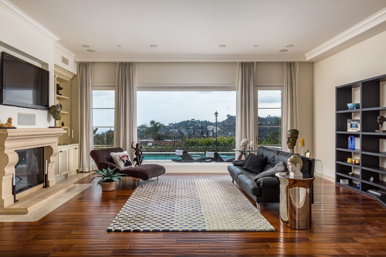 A living room with a couch, chair and table.